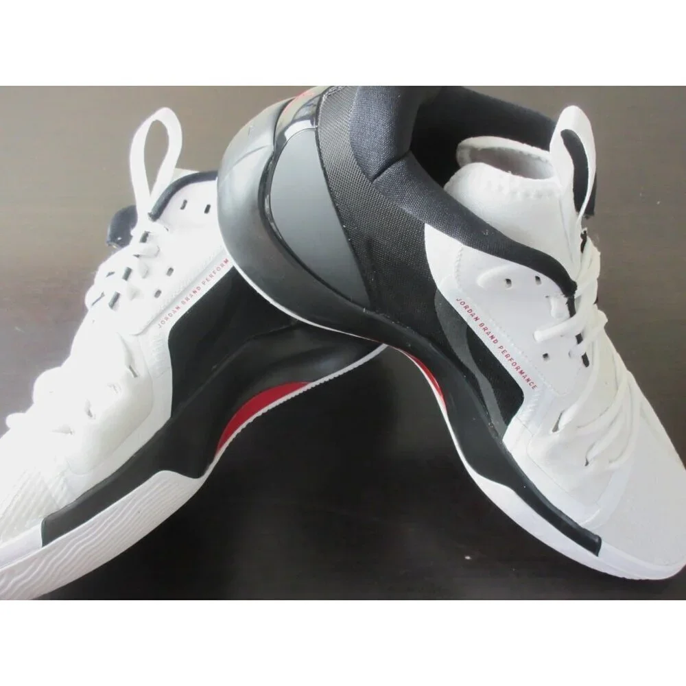 Jordan White and Black Low-Top Athletic Sneakers with Red Logo